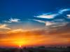 Reddish sunsets or sunrises aerosol particles